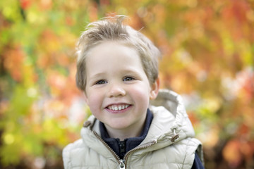 boy in autumn season in a park