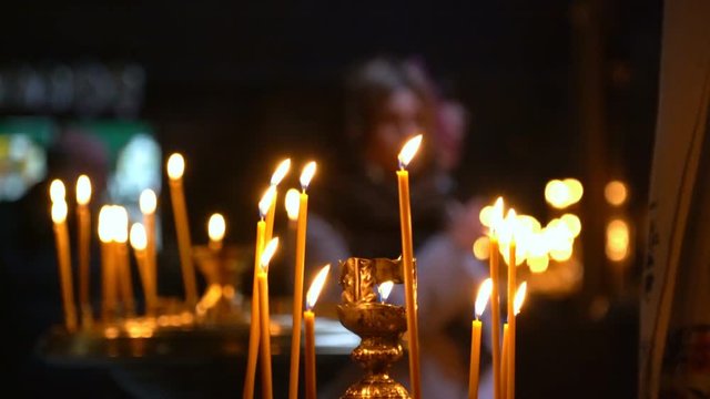Candles Are Lit in the Foreground. the Church Came Luthi They Face Pray Candles, Crosses and Prayers