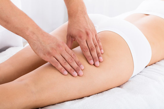 Therapist Giving Led Massage To Woman