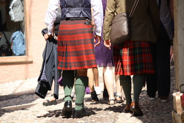 Malcesine. Garda lake. Men wearing kilt, walking in the street