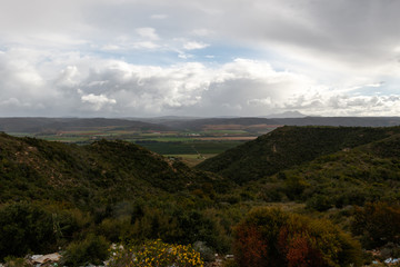 Fototapeta na wymiar Beautiful South African landscape with farm land in the backgrou