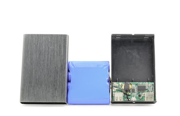 Broken battery power bank with aluminium casing on white background
