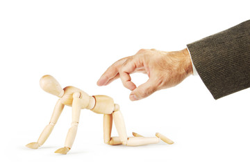 Man wants to hit another to the ass with a forefinger. Abstract image with a wooden puppet