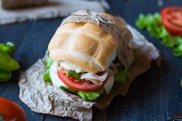 Fresh and tasty sandwich with ham and vegetables