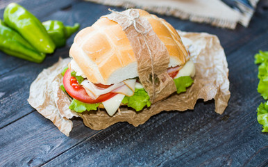 Fresh and tasty sandwich with ham and vegetables