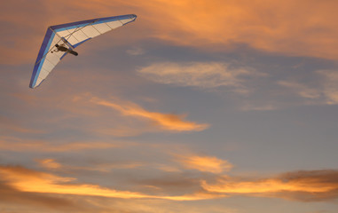 Hang Glider - Hang glider fling over the ocean at sunset