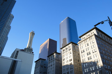 Obraz premium Skyscraper is on the blue sky background. High building is in Los Angeles, the downtown. 