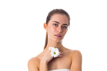 Young woman holding white flowers