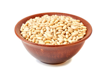 Ceramic bowl with canellini beans on white
