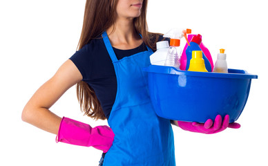 Woman holding cleaning things in washbowl