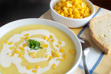 
Sweet corn soup in a white bowl

