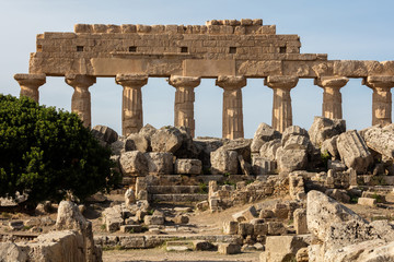 Fototapeta na wymiar Ruins of the Temple G (540–480 BC) in Selinunte, Sicily. One of the largest temples in antiquity, it reached a height of 30 m (98 ft) when complete.