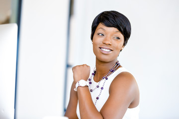Portrait of businesswoman working at her desk in office