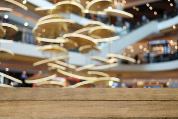 Empty wooden table and supermarket blurred background.For product display