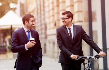 Young businessmen with a bike