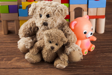 Teddy bears on on wooden background