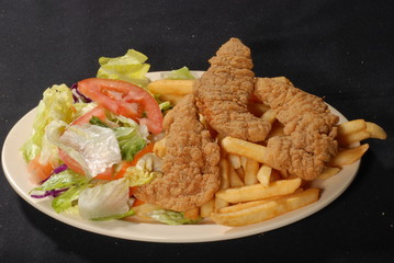 breaded chicken strips with fries and salad