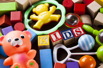 Children's of toy accessories on wooden background
