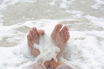 Fototapeta premium relax foot sea and small waves