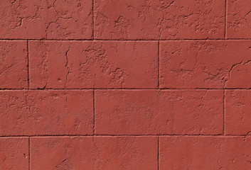 Red cinder block wall forms a pattern that can be used for backgrounds.