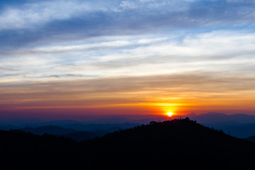 Colorful sunset over the mountain hills