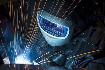 Industrial steel welder in factory