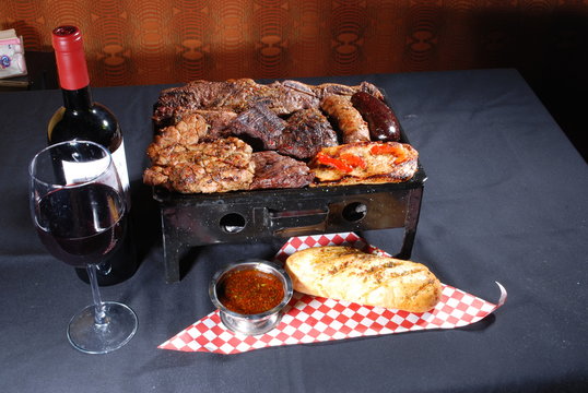 Parrillada Argentina with wine and bread