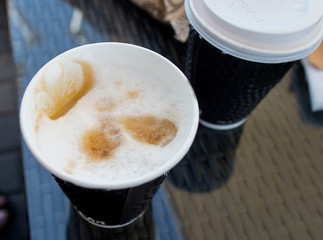 Coffee in paper cup close up with copy space