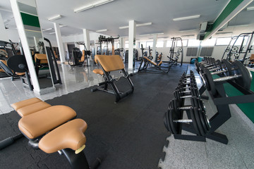Fototapeta na wymiar Large Modern Gym With Workout Equipment