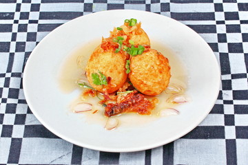 Fried hard-boiled eggs with tamarind sauce call as Khai Luk Keoi in Thai ,which mean egg gift  from son-in-law , is tasty as sweet sour and little spicy topped crispy skin of boiled egg. 