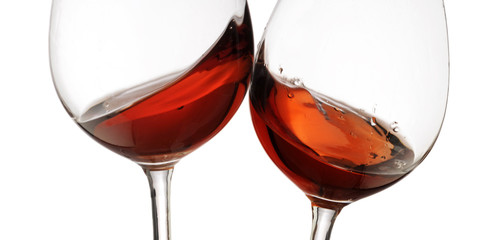 Toasting gesture red and white wine with splash, cheers close up with wine isolated 