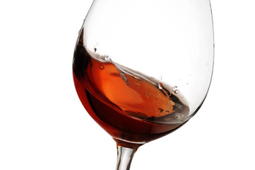 Red wine splash with white background, close up