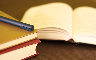 book on wooden deck table