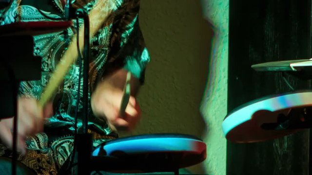 Closeup Drummer Plays on Modern Drum in Night Bar under Flashes