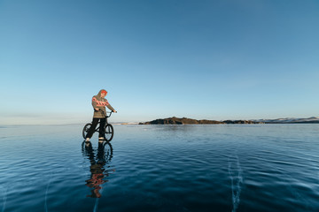 Girl on a bmx on ice.