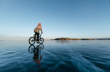 Fototapeta premium Girl on a bmx on ice.