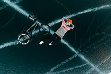 Girl on a bmx on ice.