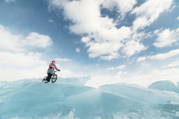 Girl on a bmx on ice.