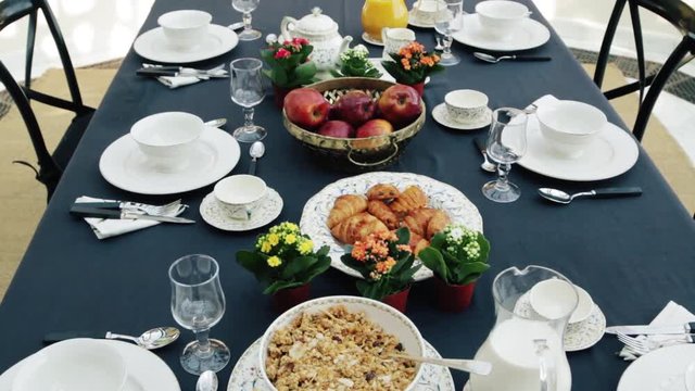 Beautifully served table with breakfast. Buffet served on the terrace.
