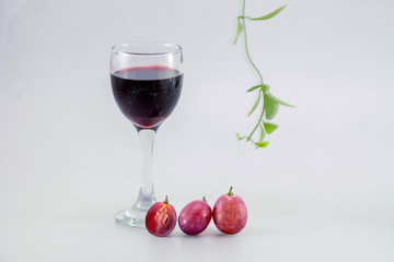 glass of wine and grapes, isolated on white