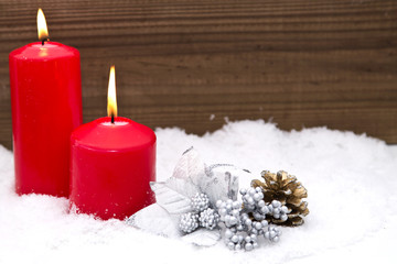 Christmas candles in the snow