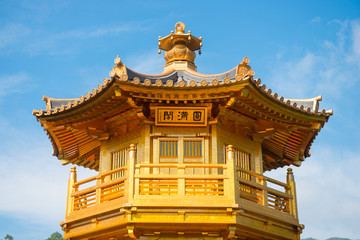 Fototapeta premium The golden pavilion and red bridge at Nan Lian garden, Hong Kong