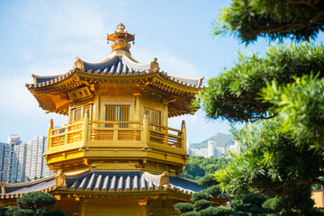 Fototapeta na wymiar The golden pavilion and red bridge at Nan Lian garden, Hong Kong