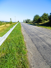 Asphalt road and summer landscape