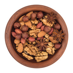 Mixture of nuts in a ceramic bowl isolated on white background.