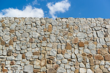 Stone retaining wall and the sky