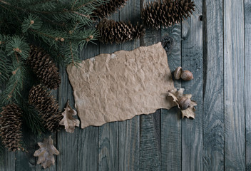 Christmas background with old paper in vintage style on wooden p