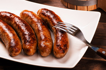 Grilled sausages with beer mug