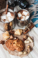 Metal mugs with cacao and marshmallows