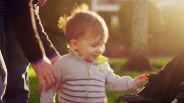 Parents on a walk with their little boy on a fall day